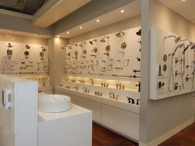 Shower and bathroom faucet display in the Green Art Plumbing Supply Showroom